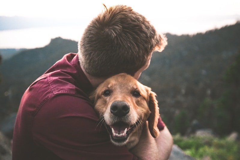 files/man-hugging-golden-retriever-dog-outside.jpg